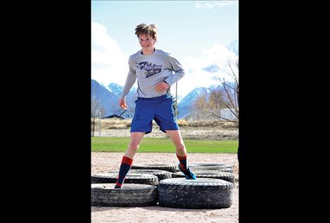 Wills DeGrandpre, 17, finishes the obstacle course.