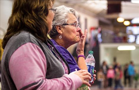 Ten-year survivor Sandy Colter brushes away emotion during the survivors walk,