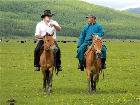 Greg Schatz rides in Mongolia with Otgon Badan, tourism manager for the national parks in the Darhad Valley.