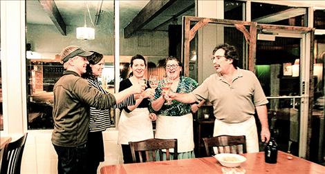 Regular cutomers, turned fun friends Tim Skiftun and Kelly Davis celebrate the cafe’s recent move and the new season’s first Friday night dinner with Diana Sheffied, Mary Frances and Gino Caselli.