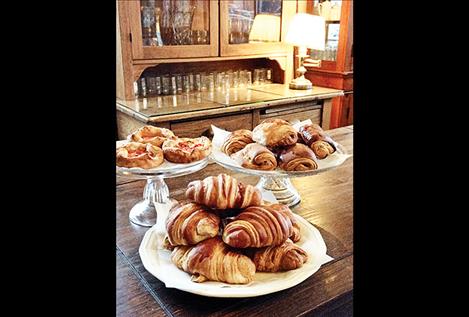 Croissants, savory tomato and goat cheese puffs, and pain au chocolat are among the variety of fresh specialty pastries baked daily at the cafe.