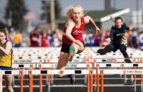 Arlee’s Carly Hergett competes in the 110 hurdles, placing first with a time of 16.78.