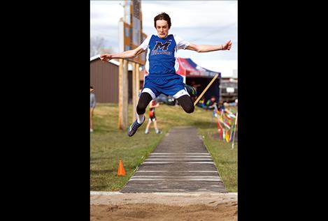 Mission’s Flint McPherson leaps in the long jump.
