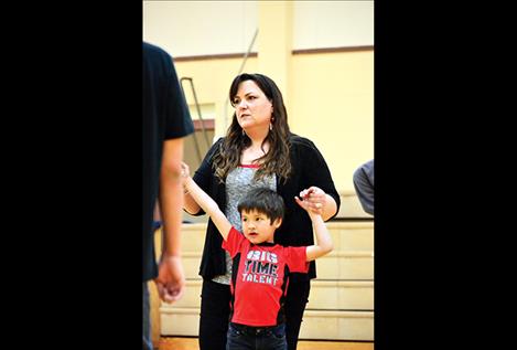 Friends Forever Mentoring Executive Director Julia Williams plays basketball with the kids during family night in Arlee.