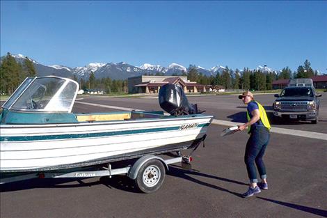 Inspectors check a boat last spring at the checkstation in Pablo. SB 363 will increase fundiing to prevent the spread of aquative invasive species, like zebra and quagga mussels.
