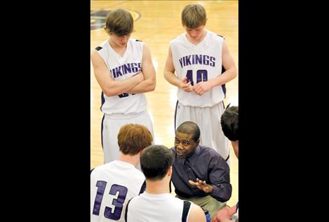 Head coach Mike Brown talks strategy with the Vikings.