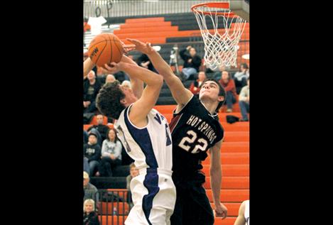 Freshman Jade Smith draws a foul from Hot Springs' Wyatt Nagy.