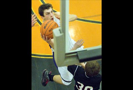 Webb O'Neill drives to the bucket.