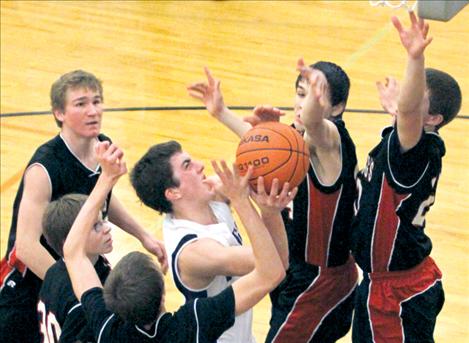 Webb O'Neill fights through a pack of Hot Springs defenders.