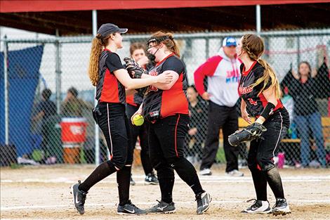 Maidens’ Marissa Mock and teammates celebrate her 1-3 double play.