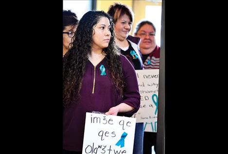 Gena Montoya, CSKT mental health provider, walks with a group as they move into the Confederated Salish and Kootenai Tribal Council room to bring awareness to sexual assault during the national Sexual Assault Awareness Month.