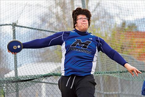 Mission’s Michael Durglo throws for 126 feet.