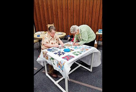 Approximately 20 local sisters gathered to make quilts and hygiene kits for local children in need.