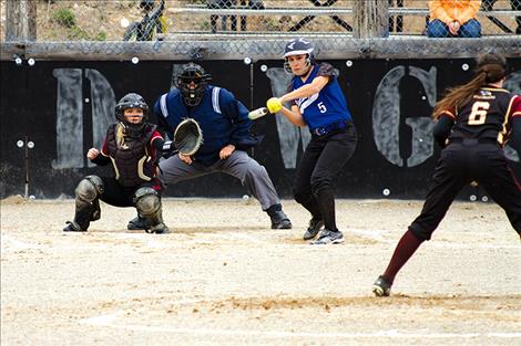 MAC’s Summer DarcAngelo takes a swing against Florence.