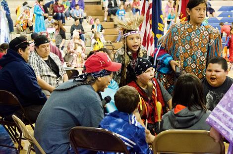 The youngest drum group at the powwow shares one of the songs they learned with the community.