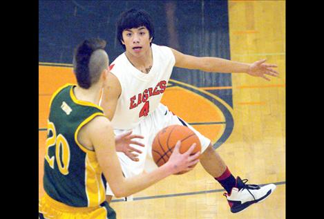 Darius McDougall guards a St. Regis player.