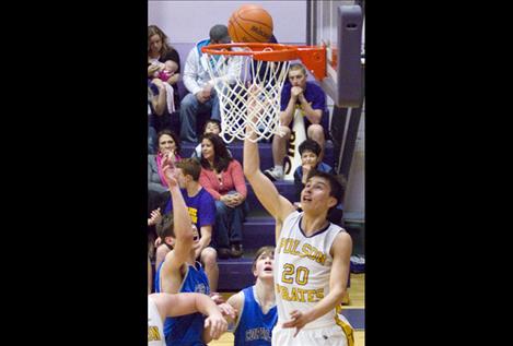 Sophomore Cedric Earthboy puts up two points against Corvallis.