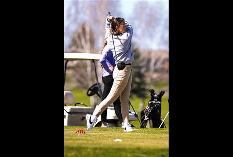 Maidens’ Brooklyn Olson watches her drive during the Ronan Invitational at the Mission Mountain Golf Course on April 11.