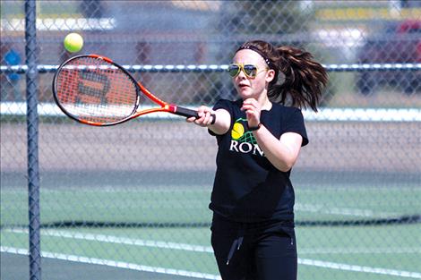 Ronan Maiden Maddy Sevier returns a serve during singles action.