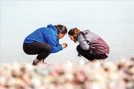 Alexis Lachance and Mariah Durglo take a close look at some rocks during the mussel walk.