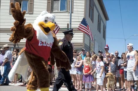 Eddie the Eagle, an NRA gun safety mascot, joins the festivities alongside Polson Police at the Fourth of July parade.