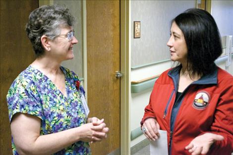 Leah Emerson, St. Luke director of nursing, talks with Valerie Johnson, recipient of the first Echo DeLong Memorial Scholarship. Johnson is a nursing student at Salish Kootenai College.