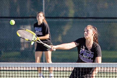 Lady Pirates’ doubles team Cassie Carlyle and Kyler Lundeen enjoys a little sunshine during the match.