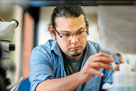 Matthew Weingart, a graduate student in Earth Sciences at Montana State University, catalogs carbon samples on Friday, March 31, in Bozeman.