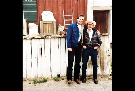 Tim Ryan Rouillier stands with his grandfather, Vic Cordier, years ago. They traveled across Montana to play music together before Cordier died on stage during a concert at the age of 93.