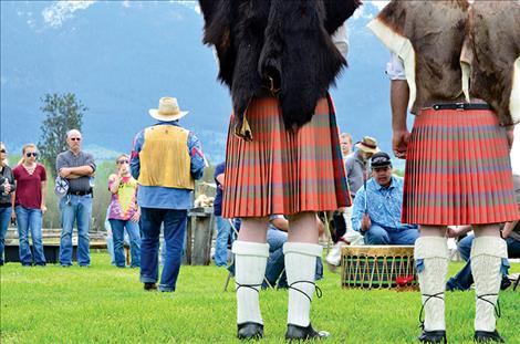 Bagpipe players listen as the Buckshot Drum group plays an