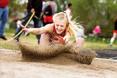 Arlee’s Carly Hergett competes in the long jump.