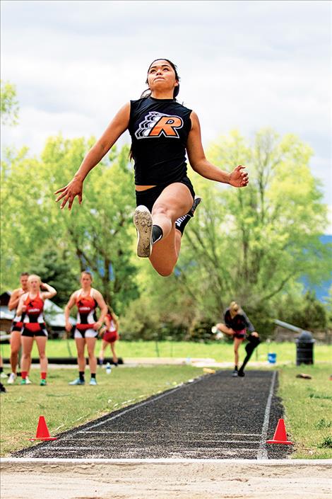 Lee Camel wins the long jump with a jump of 15 feet, 11 inches.