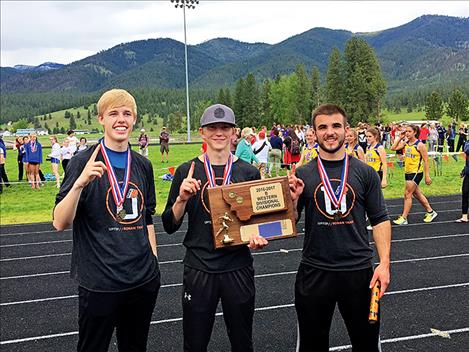 Ronan boys track team members pose with their 2016-17 Divisional Championship trophy.