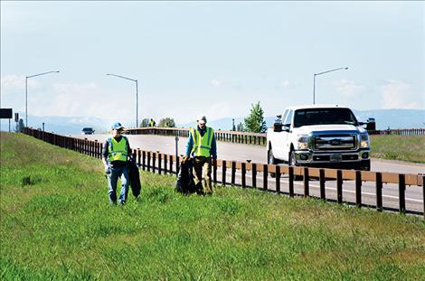 Salish Kootenai College faculty members pick up trash along U.S. Highway 93 during a day of community service the college observes annually.