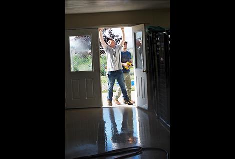 Volunteers  fix the trim on  the Mission  Valley Animal Shelter. 