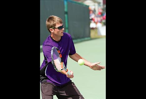 Polson’s Colin Kenney returns a serve.