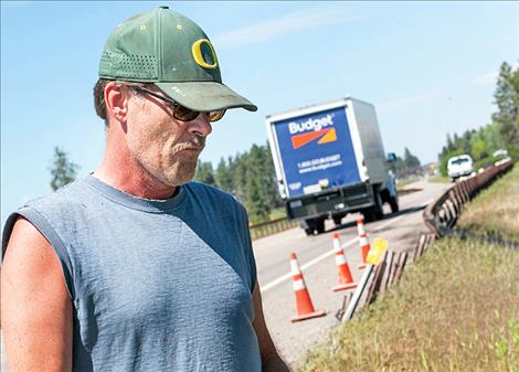 Gary Dullinger stands close to the site on US 93 where his son died two years ago.