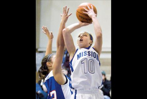 Senior Lady Bulldog Stephanie Lewand- owski shoots for two during a game against Bigfork  earlier this season. Lewandowski averaged nearly 20 points a game during her final season for Mission.