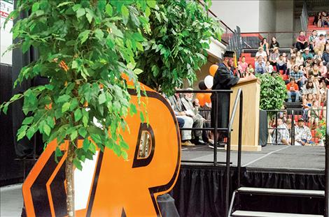 Class salutatorian Collin McGuyer  tells the audience  he considered  failing classes  so he could  contiue being  an RHS student,  but he later  changed  his mind. 