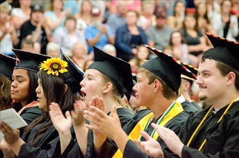 Ronan grads applaud graduation speakers.