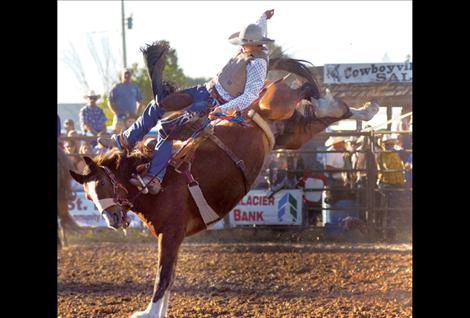 Sterling Davis participates in the Pioneer Days saddle bronc event.