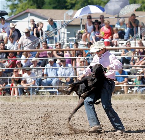 Donnie Benson takes down a calf.