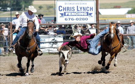 Will Powell prepares to take down a steer during the Pioneer Days steer wrestling event.
