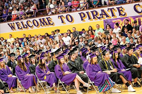 One-hundred and twelve Polson students participate in their graduation ceremony as family and friends look on.