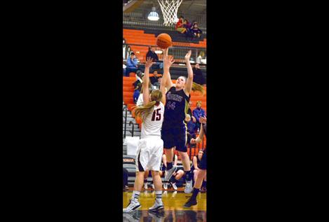 Polson’s Heidi Rausch heads for the hoop in Friday’s opener.