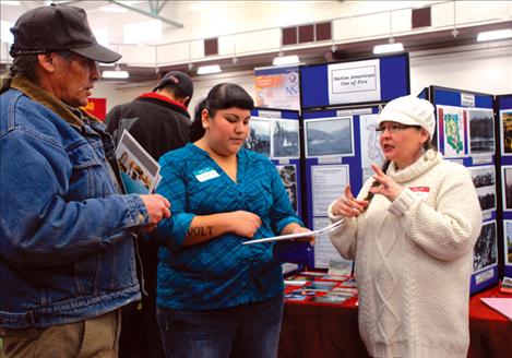 Roian Matt, right, and James Morigeau answer student Sasha Rivers’ questions about the Confederated Salish and Kootenai Tribal Division of Fire.
