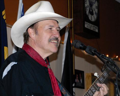 Entertainer/songwriter Rob Quist smiles before launching into a song at the Winterfest. Quist writes and sings songs about the people and places of the west.