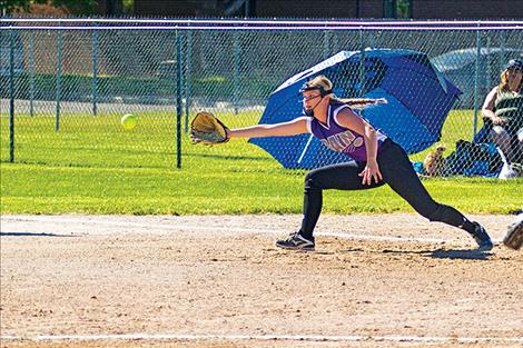 Polson Purple Rain’s Quinn Motichka stretches to make the play.