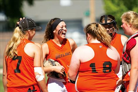 Ronan Outlaws share some laughs between innings.