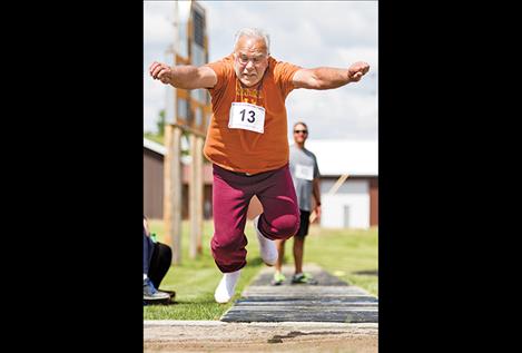 Hal “shoeless” Fullerton of Arlee launches into the air.